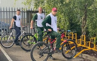 grotech colleagues with their bikes and the new cycle rack