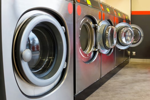 row of industrial laundry machines