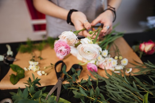 flowers being sorted by a florist