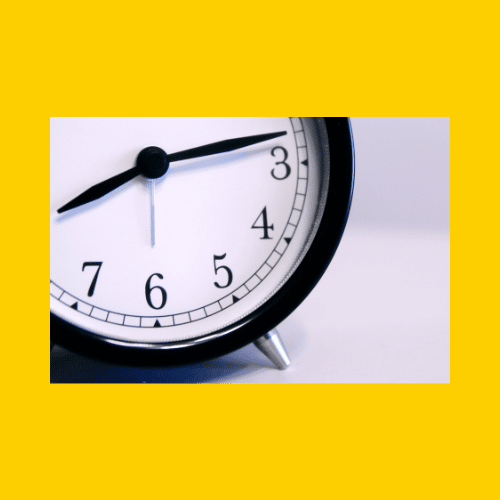Times clock on yellow background