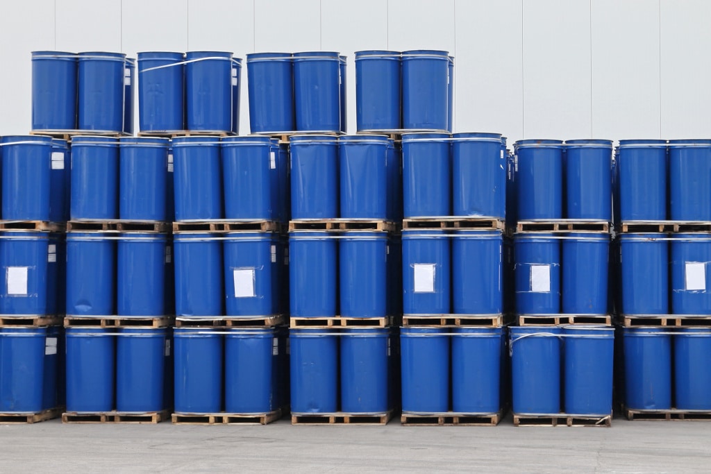 Blue metal drums filled with liquids