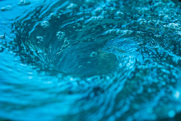 liquid spinning in a whirlpool motion