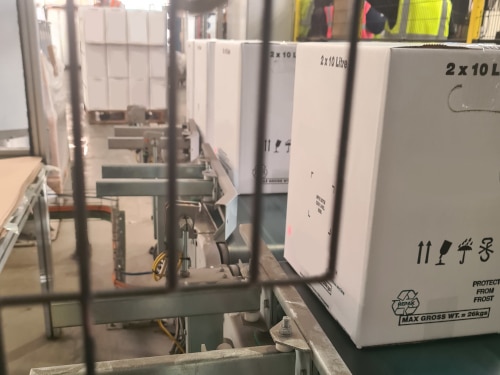 boxes of agrochem products being packed on a Grotech production line